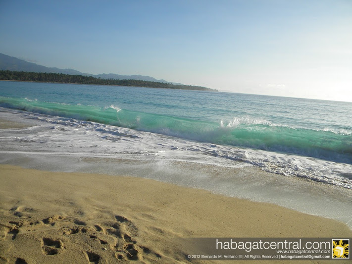 Sea blue, Sky blue and yellowish-white sand, basking in sunrise. Click here to see more photos of Dahican Beach